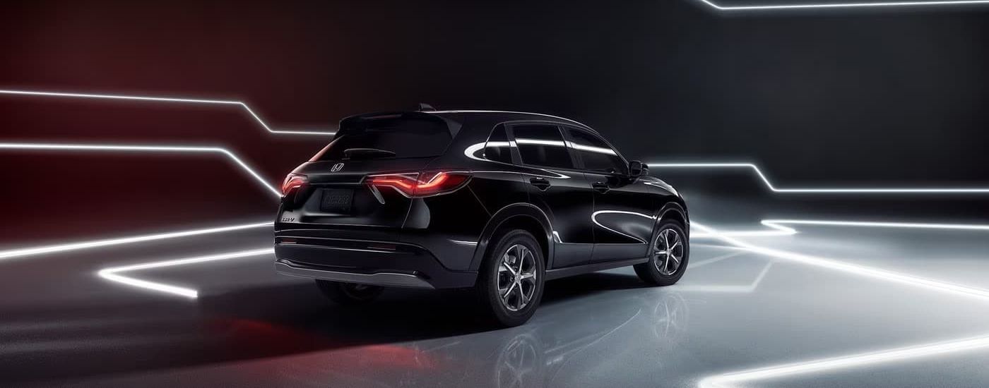 Black 2025 Honda HR-V parked on a showroom floor