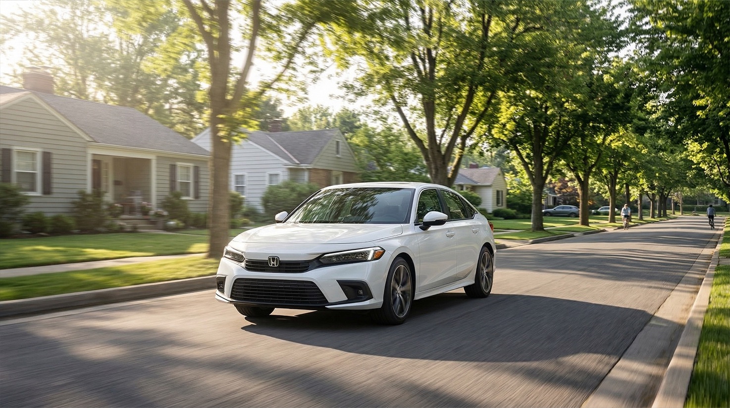Honda Civic sedan driving through a quiet suburban neighborhood representing a fuel efficient commuter car