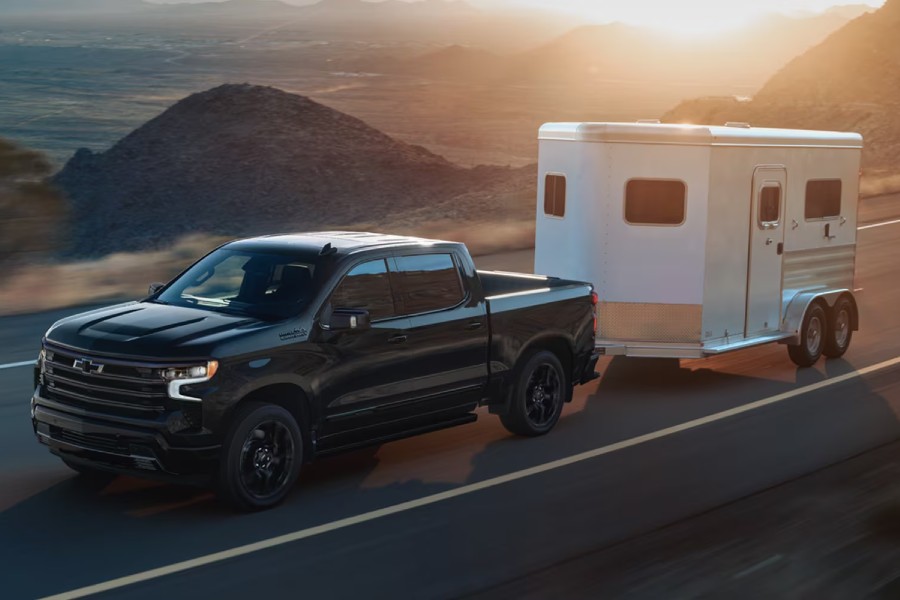 Super Cruise Enabled Chevy Silverado Exterior Driver Side Front Profile while Towing Trailer
