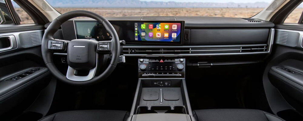 2025 Hyundai Santa Fe interior showcasing modern dashboard design, touchscreen display, and spacious cabin layout.