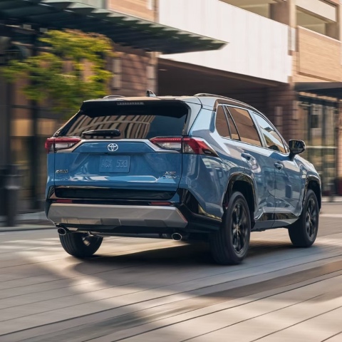 Toyota RAV4 driving down the street.