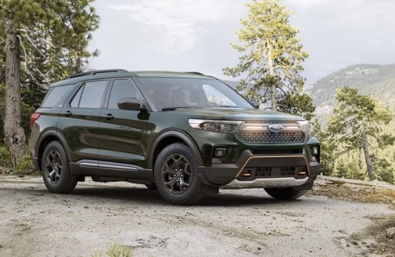 Green 2024 Ford Explorer Timberline on a Wooded Road