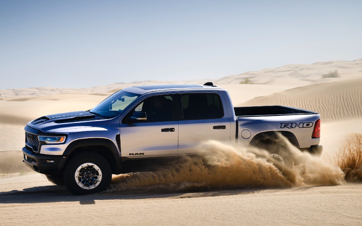 2025 RAM 1500 RHO Exterior Driver Side Front Profile on Sand Dunes