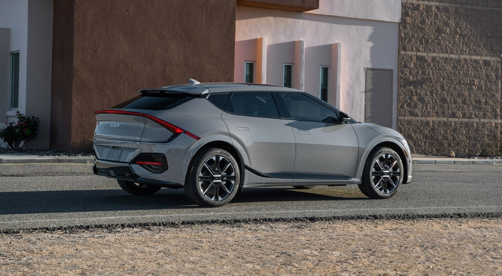 Grey 2025 Kia EV6 GT-Line parked near a Kia dealer