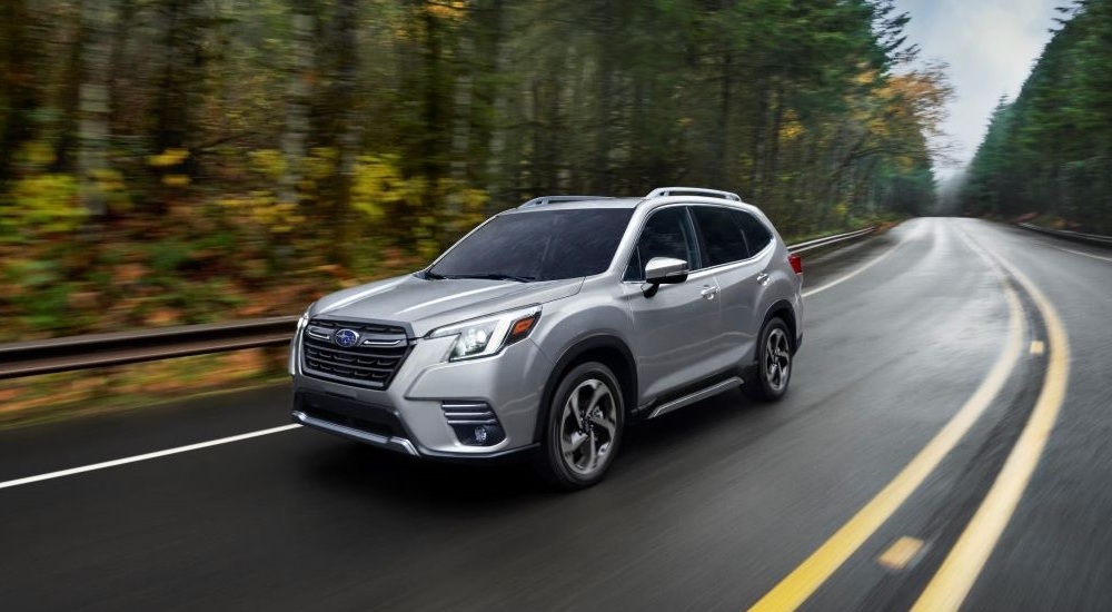 A silver 2023 Subaru Forester is shown from the front at an angle after leaving a dealer that has used cars for sale near Aztec