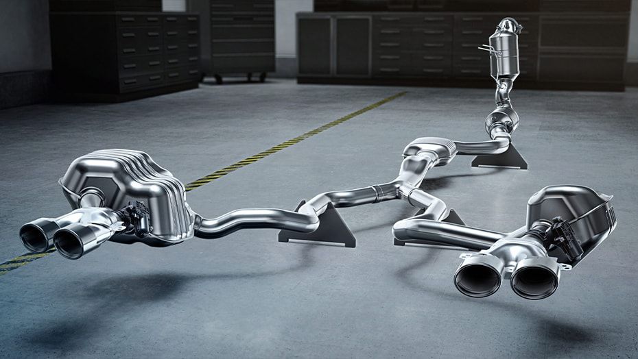 AMG C 63 S E Performance dual exhaust system detail on a shop floor