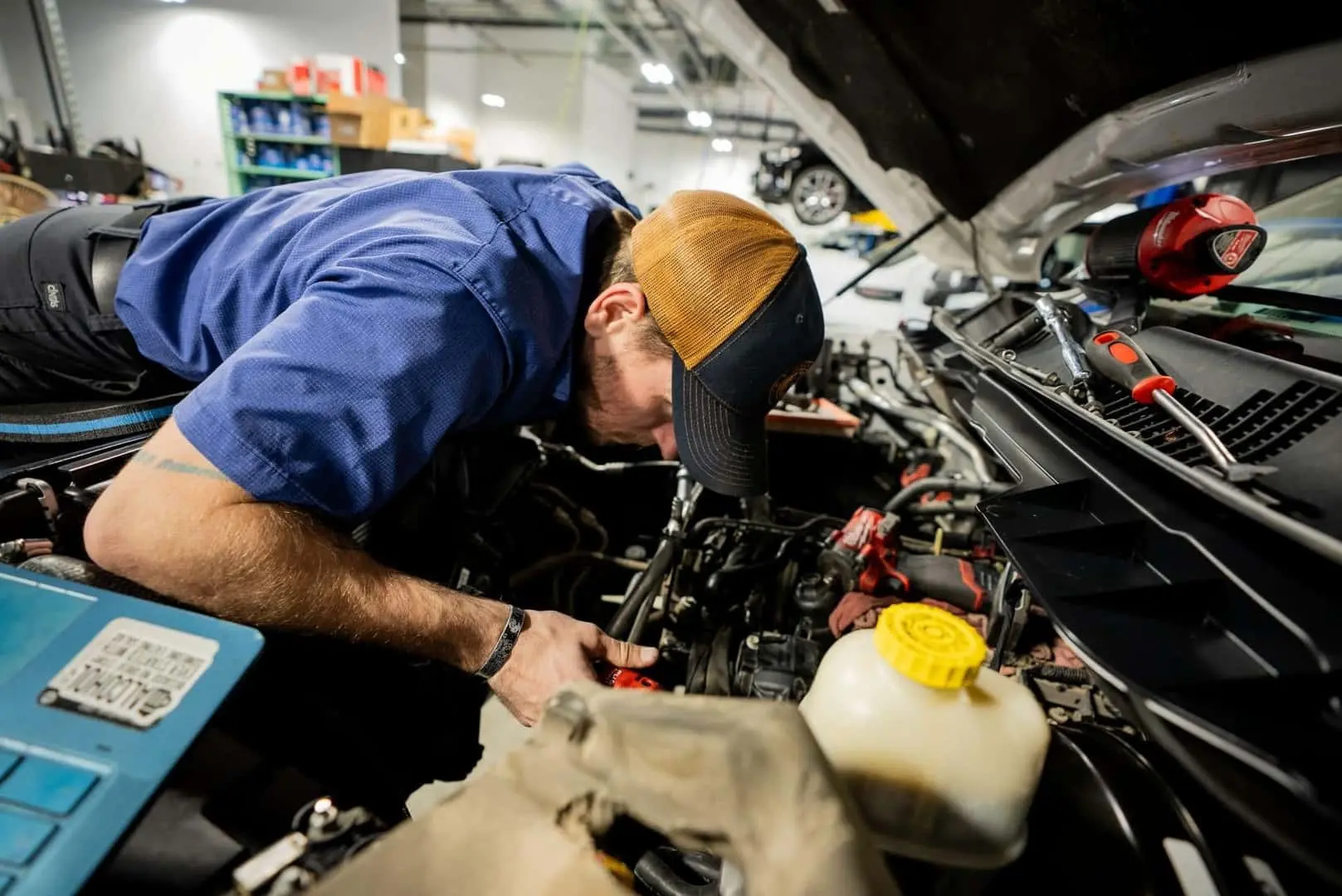 Automotive technician at Don Hattan Derby repairing a vehicle at our service center