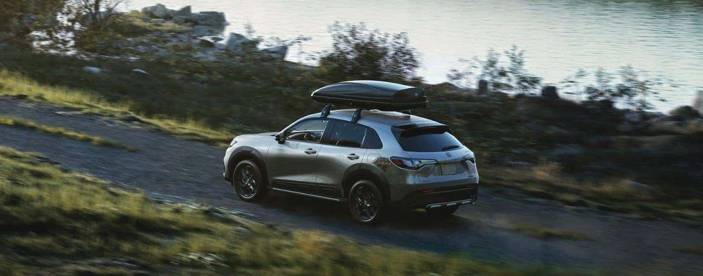 A silver 2025 Honda HR-V driving off-road.