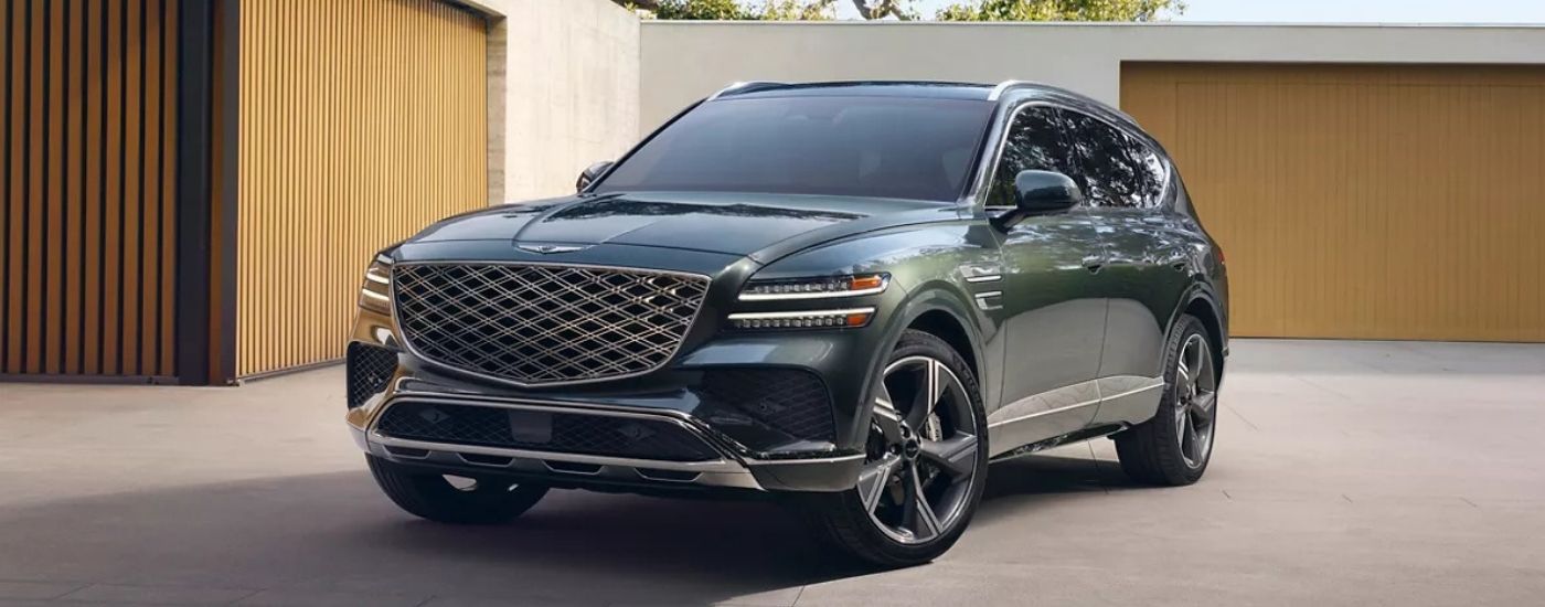 Green 2025 Genesis GV80 parked in a driveway