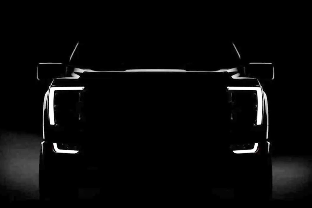 Silhouette of 2025 Ford Electric Truck with headlights on