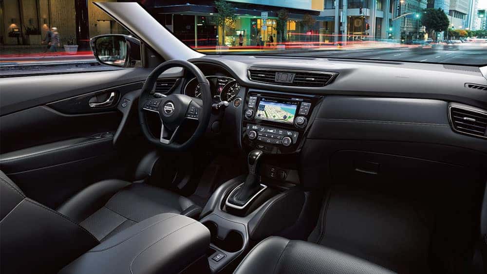 2017 Nissan Rogue dashboard with steering wheel and center touchscreen