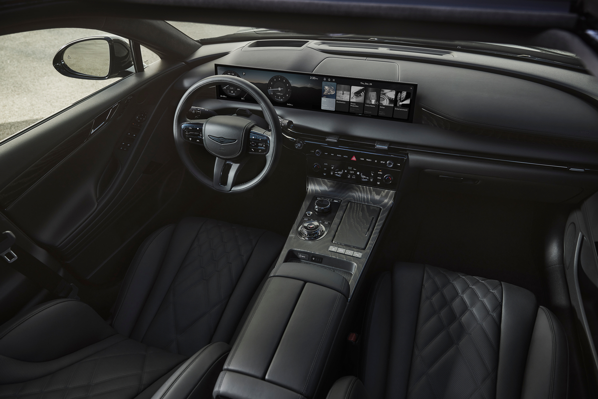 High angle interior view of blacked-out cockpit inside Genesis G80 Prestige Black