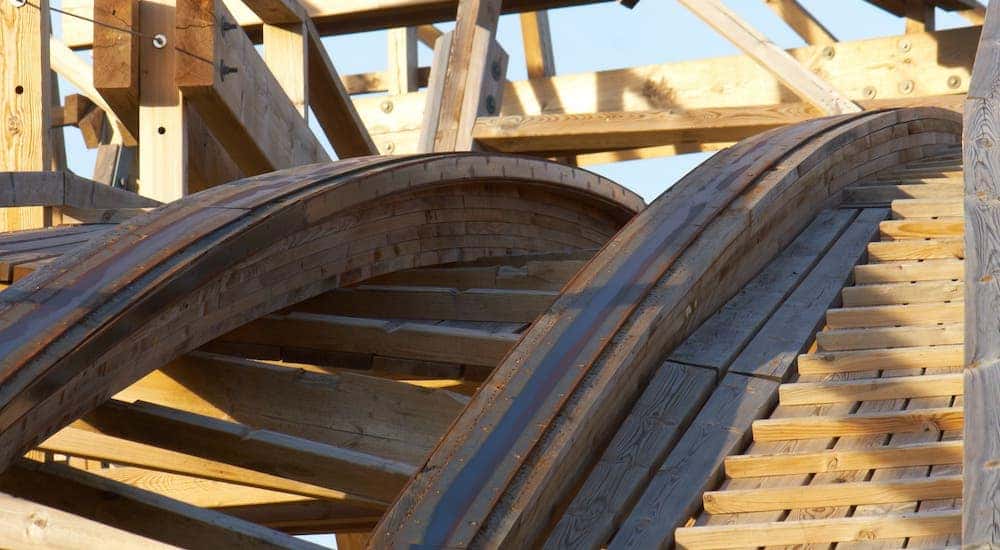 A closeup is shown of a wooden rollercoaster in Rochester, NY.