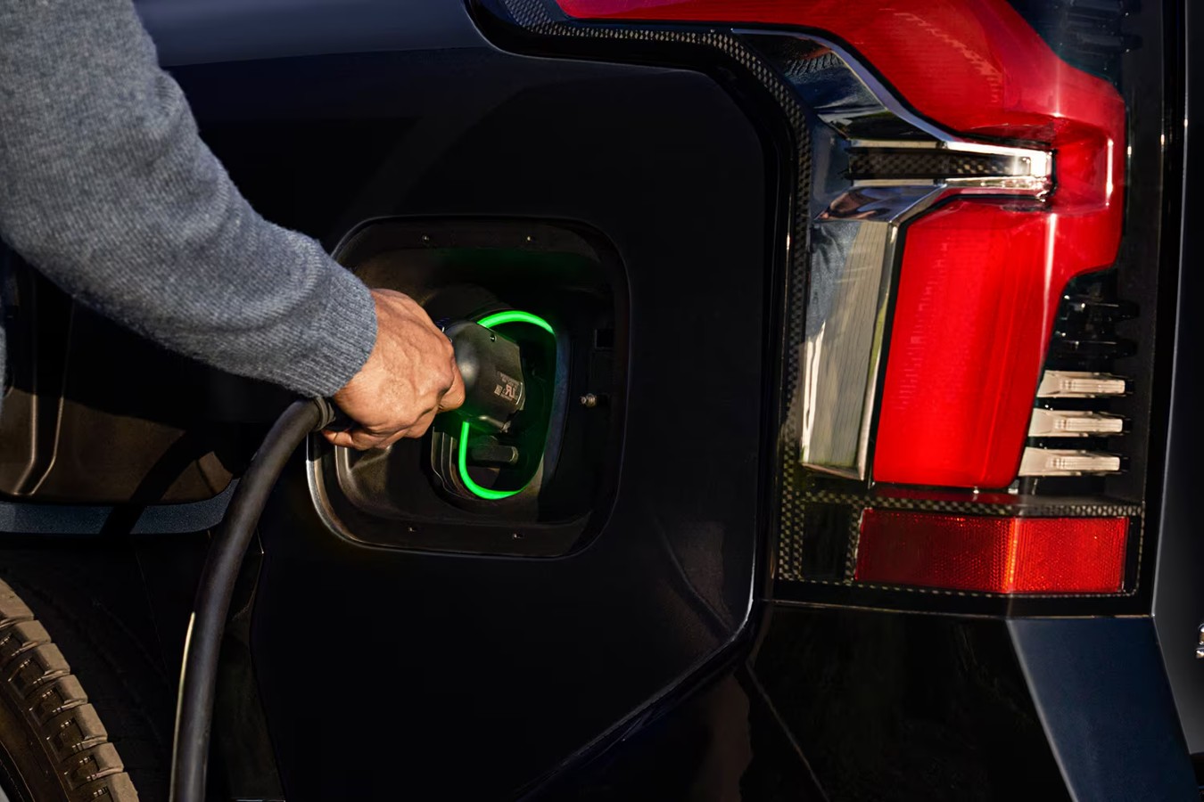 Man Using Level 1 Charging on Chevy Silverado