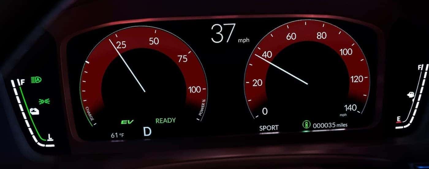 A close-up of the digital dash display is shown in a 2025 Honda Civic.
