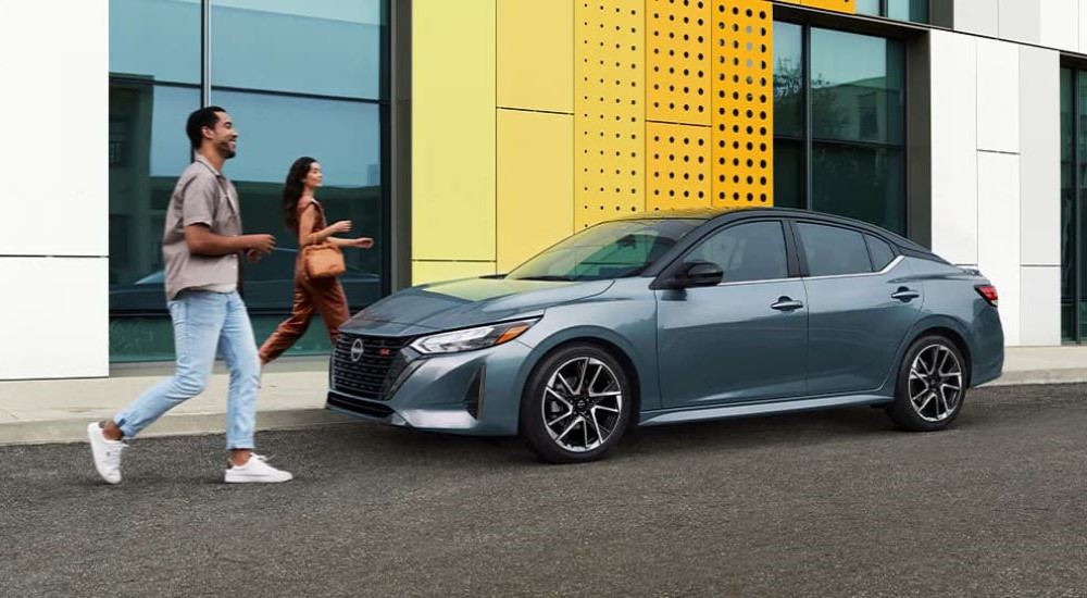 Blue 2025 Nissan Sentra SR for sale parked on a city street