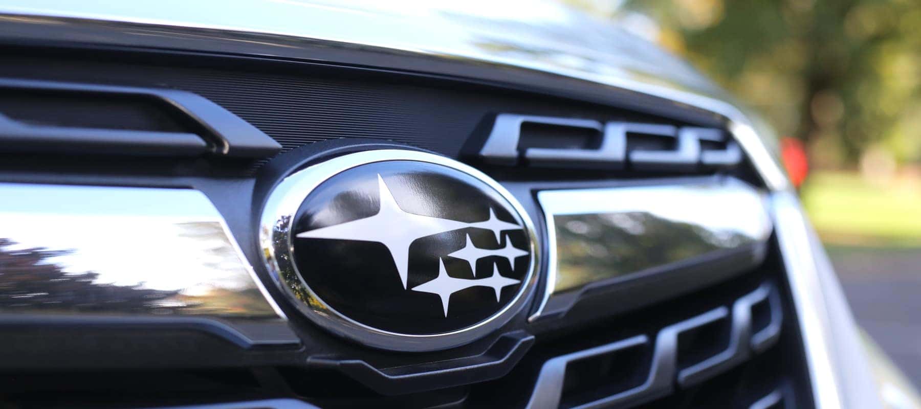 Close-up of a Subaru grille and star emblem