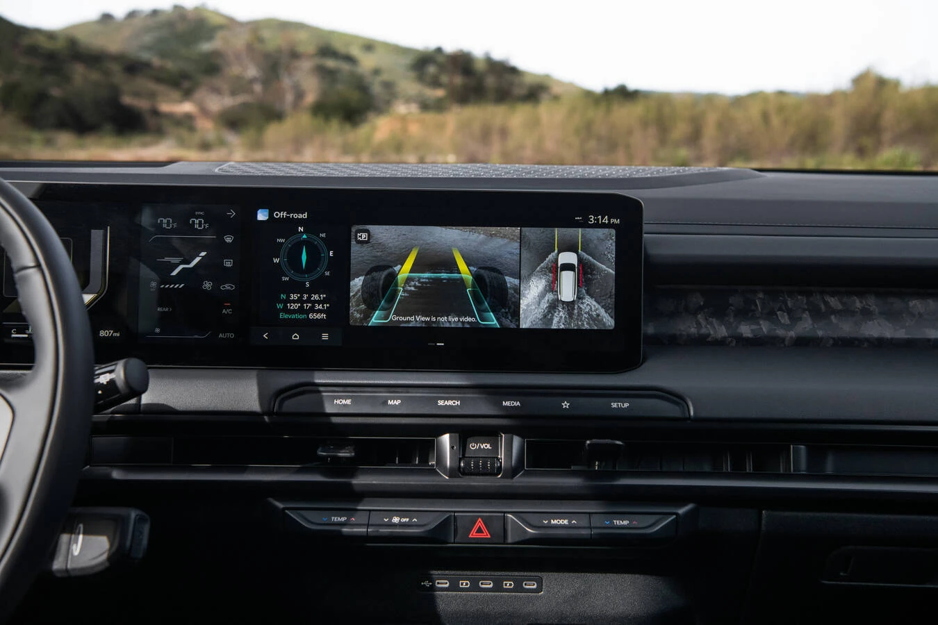 2027 Kia Telluride X-Pro dashboard showing the Off-road terrain mode screen with dual ground-view camera panels labeled "Ground View is not live video," alongside a compass reading an elevation of 656 feet.