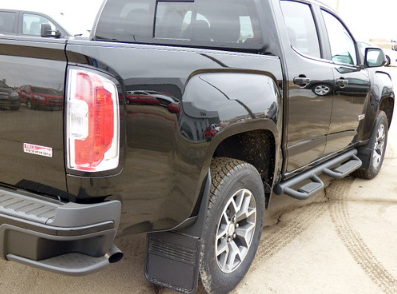 GMC Canyon truck in black paint photographed from behind.