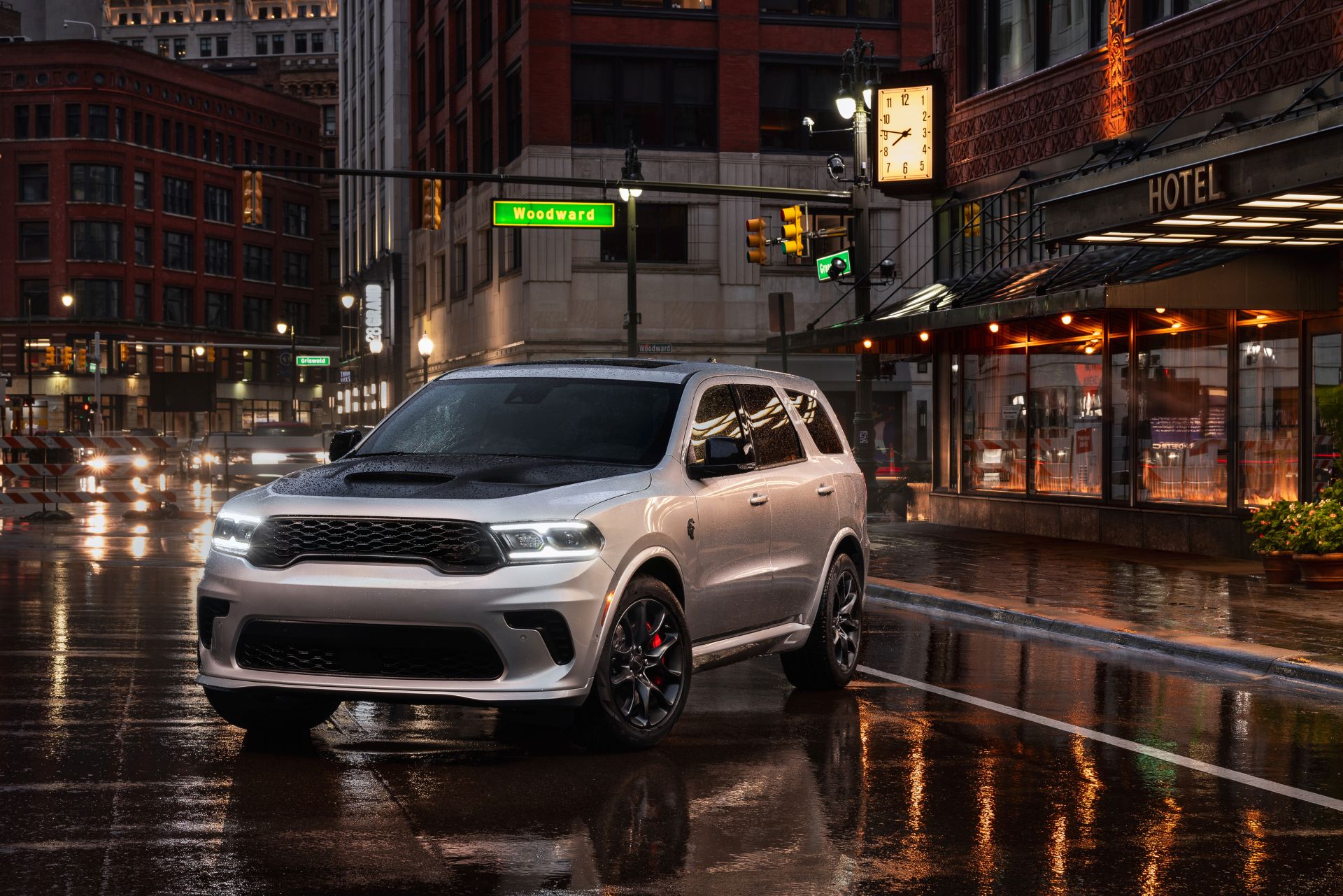 A silver suv sitting parked.