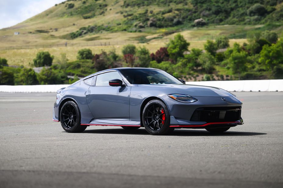 2027 Nissan Z NISMO in gray on a racetrack, front three-quarter view