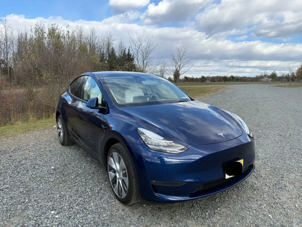 Used 2023 Tesla Model Y Long Range with VIN 7SAYGDEE8PA099303 for sale in Kansas City