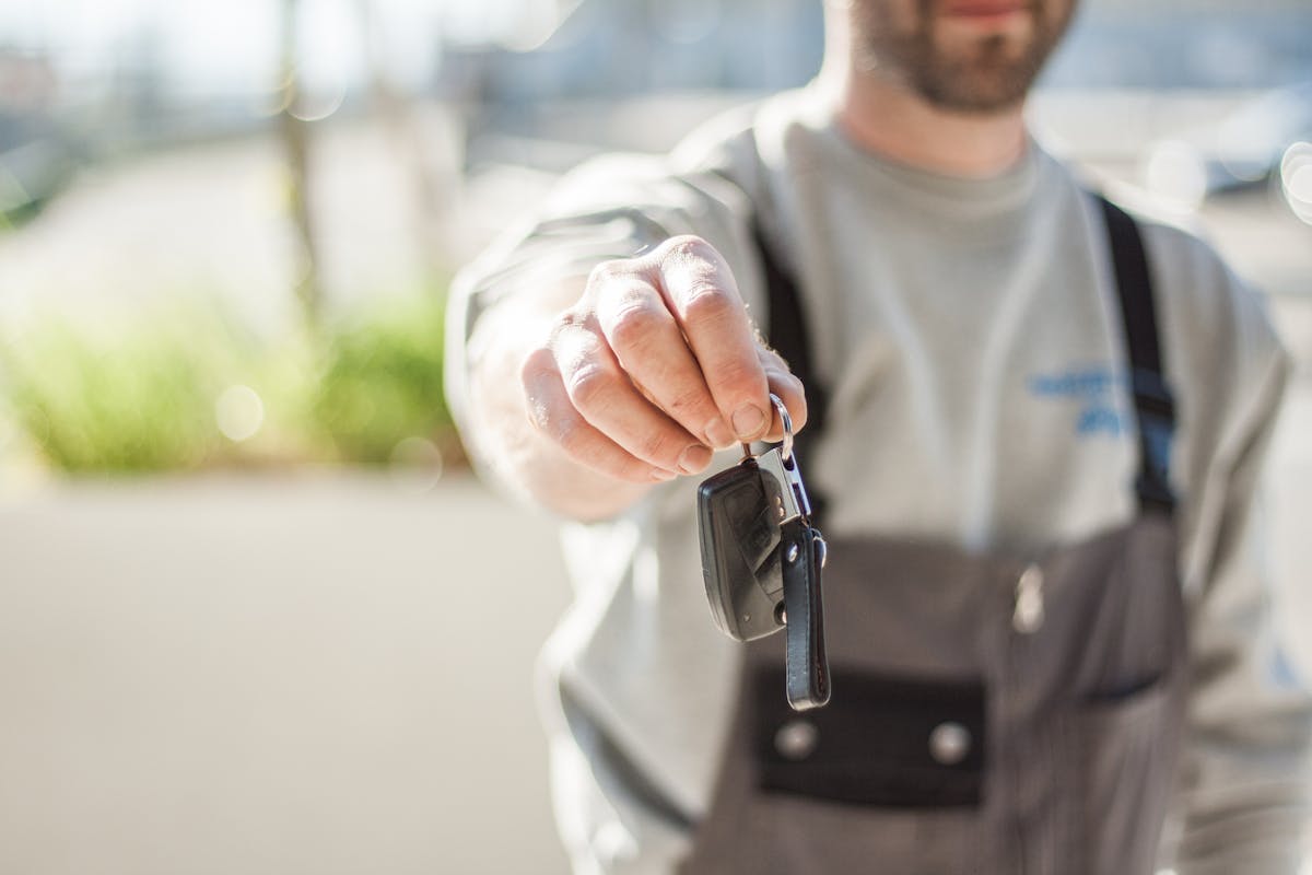 Customer receiving car keys during a trade-in at a dealership