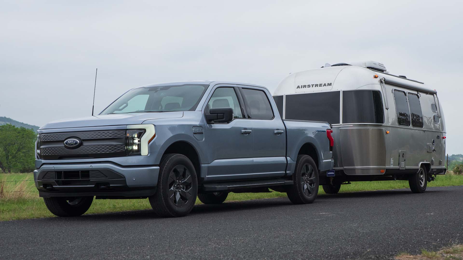 A 2022 F-150 Lightning with a RV behind