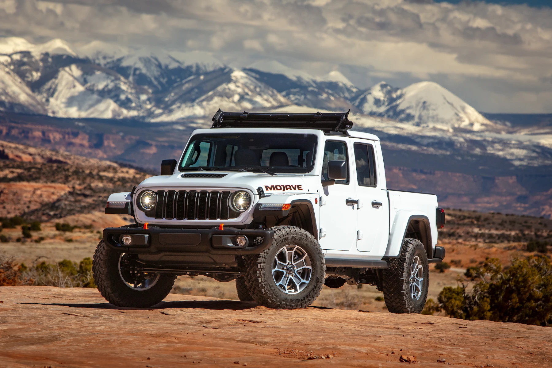 White 2026 Jeep Gladiator in mountains 
