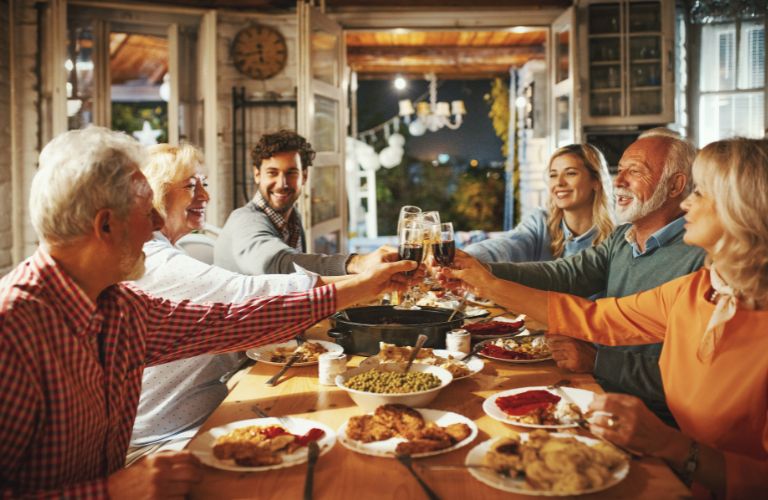 Family Making a Wine Toast at Thanksgiving Dinner