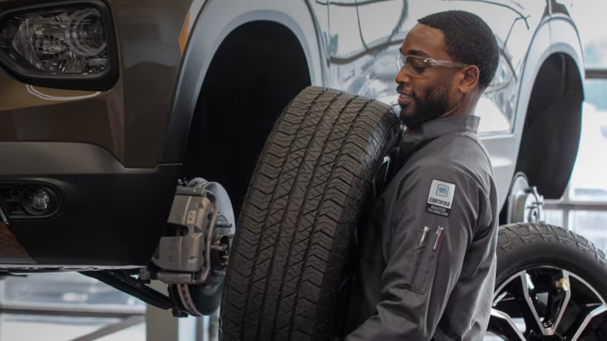 Chevy Master Technician Removing Tire