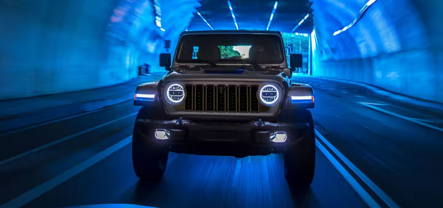 A jeep driving through a tunnel.