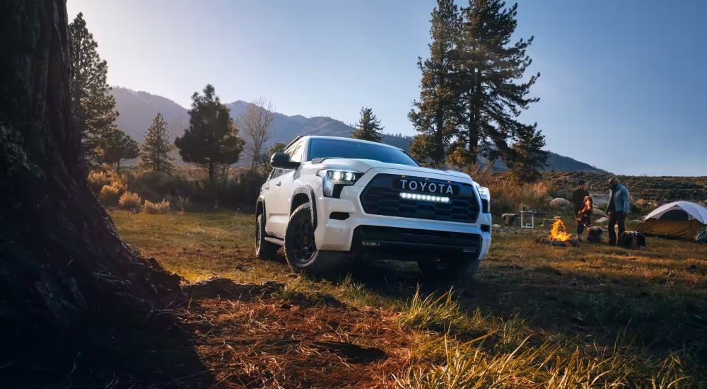 White 2023 Toyota Sequoia TRD Pro is shown at a campsite