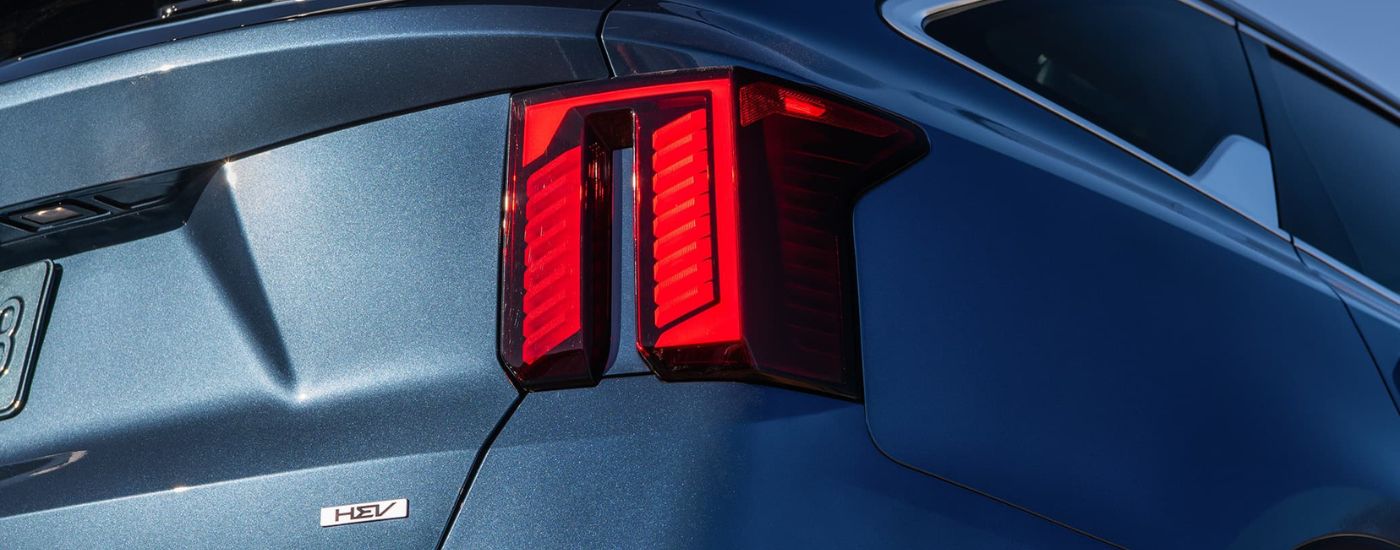 Close-up on the headlights of a blue 2024 Kia Sorento Hybrid