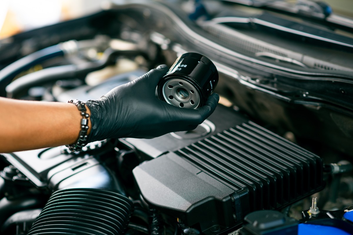 Service Technician Changing Oil Filter