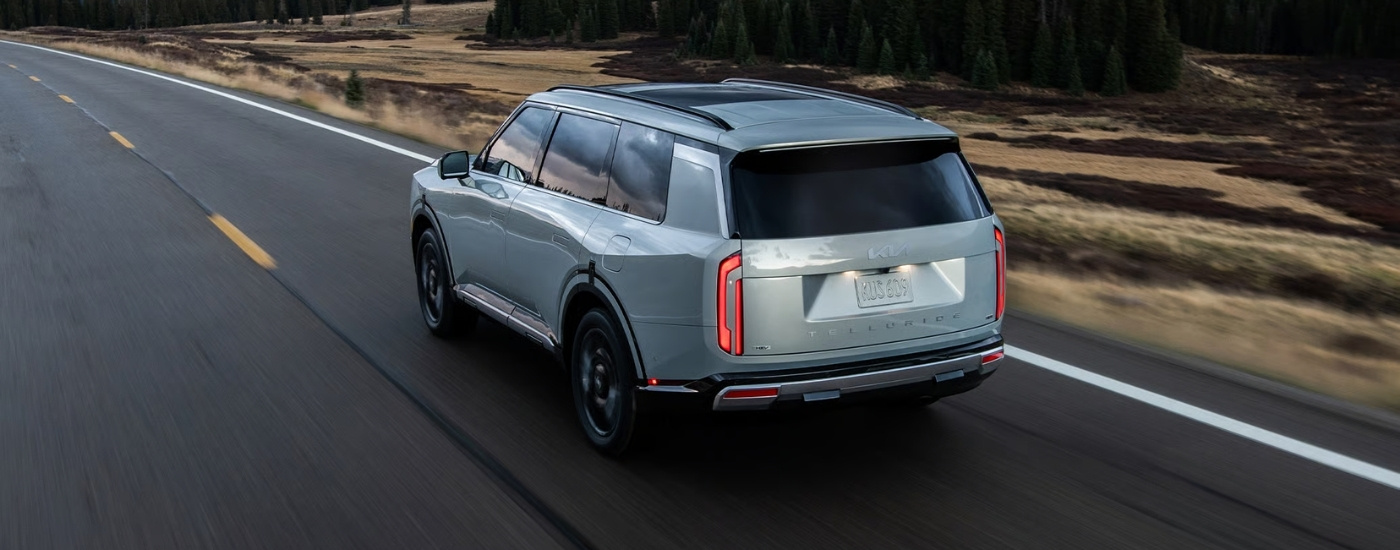 Silver 2027 Kia Telluride HEV driving on a highway