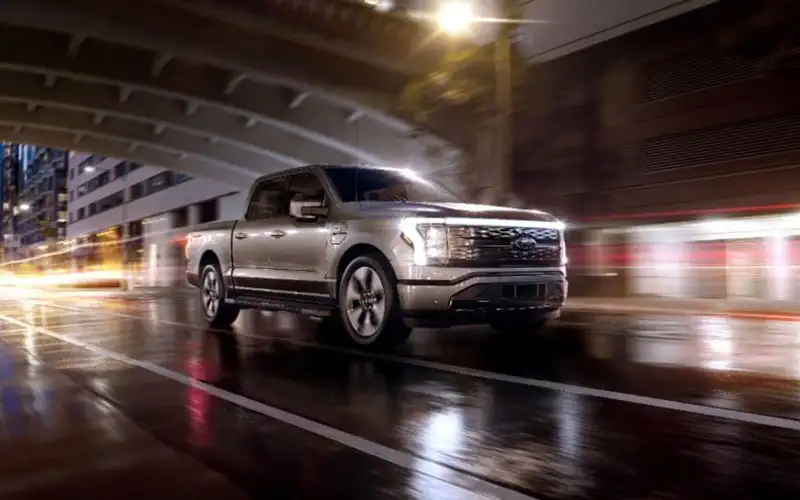 image of silver ford f-150 driving at night