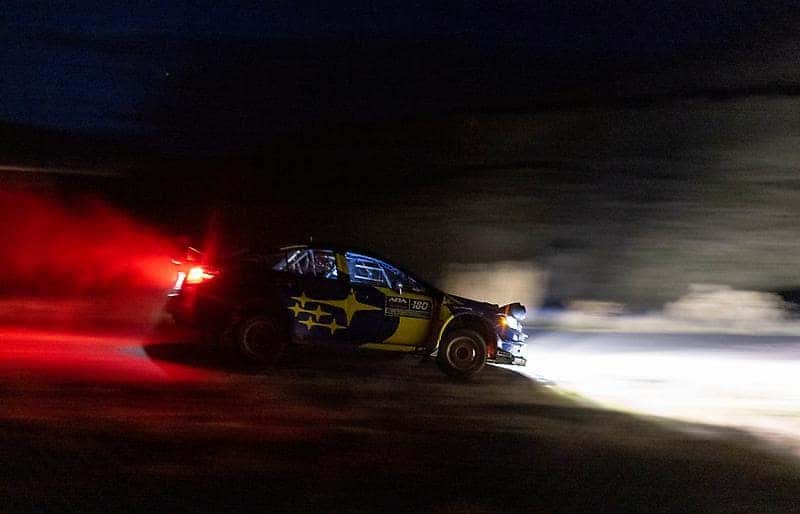 Subaru rally car racing at night