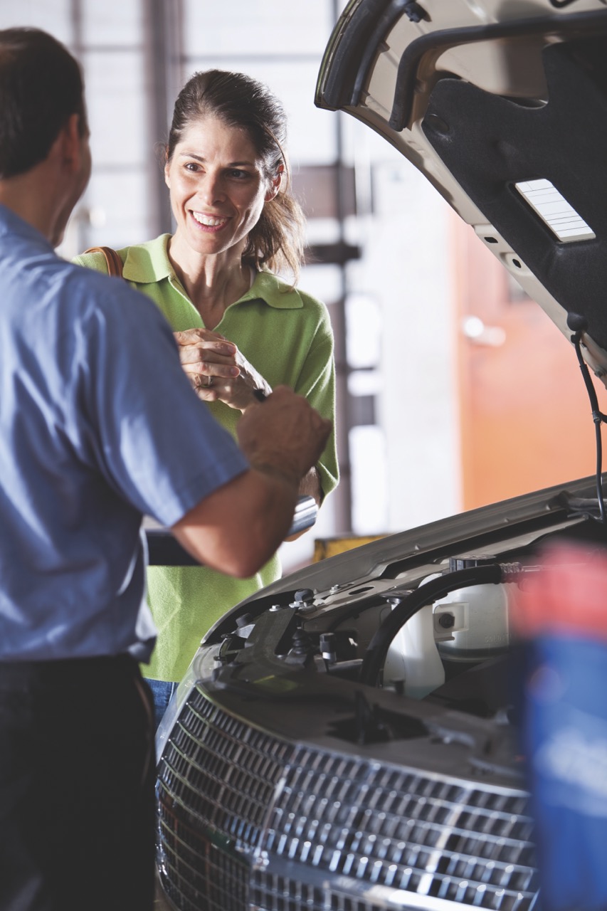 man handing woman keys