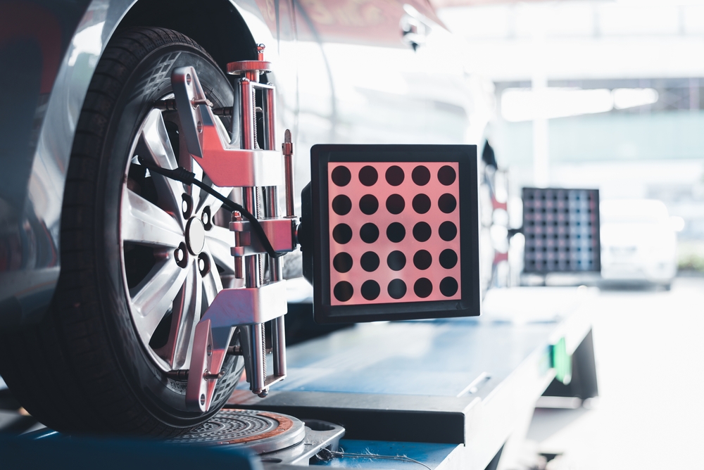 vehicle being serviced on a wheel alignment machine