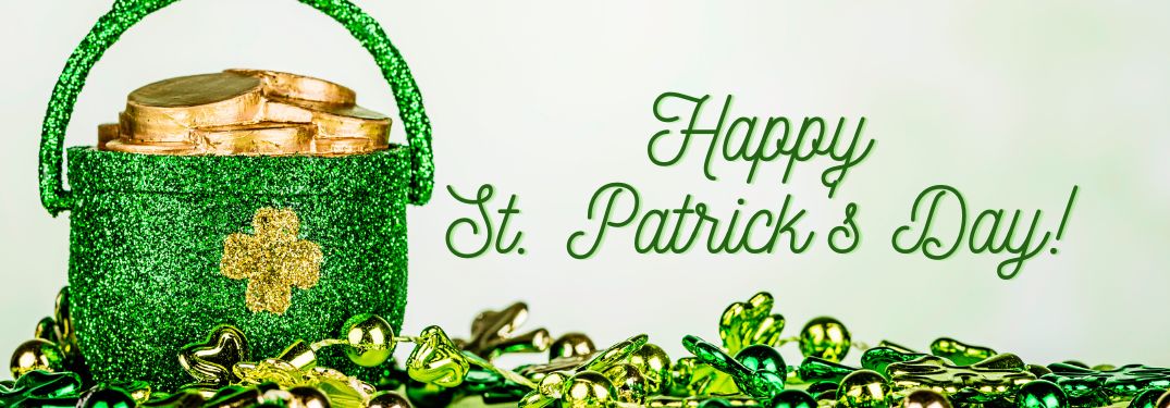 Green Pot of Gold and Green Decorations on White Background with Green Happy St. Patrick's Day Text