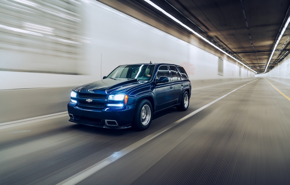 blue chevrolet vehicle driving in a tunnel