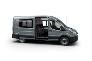 side view of a grey 2020 Ford Transit Crew Van with its side door open