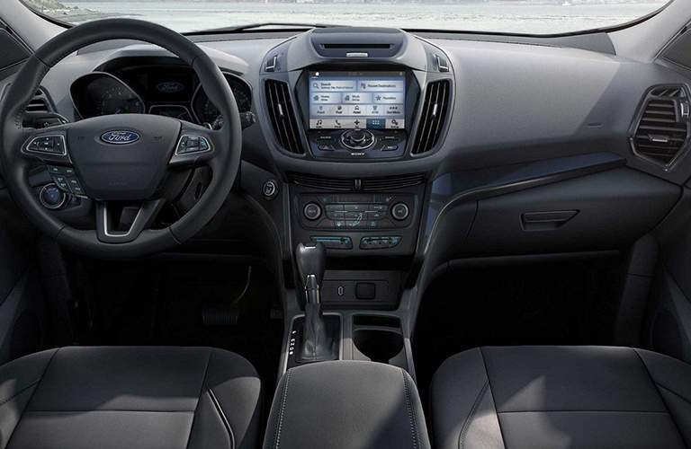 interior of 2018 ford escape with sync 3 infotainment system and steering wheel in frame