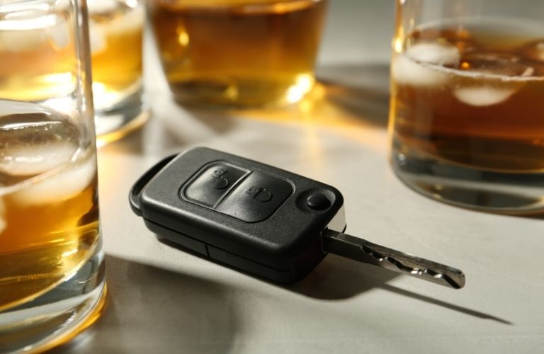 Image of alcohol and vehicle key of drunk driving.