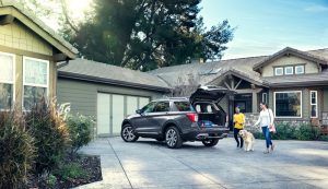 rear view of a black 2021 Ford Explorer with cargo door open