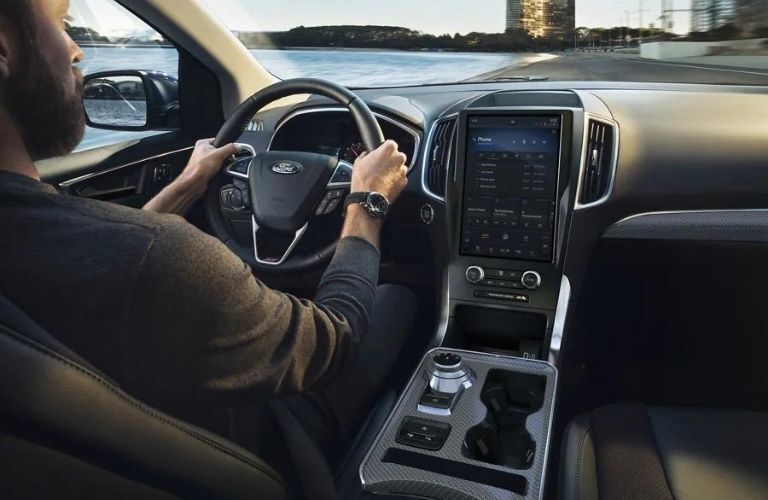 A man driving the 2022 Ford Edge. 