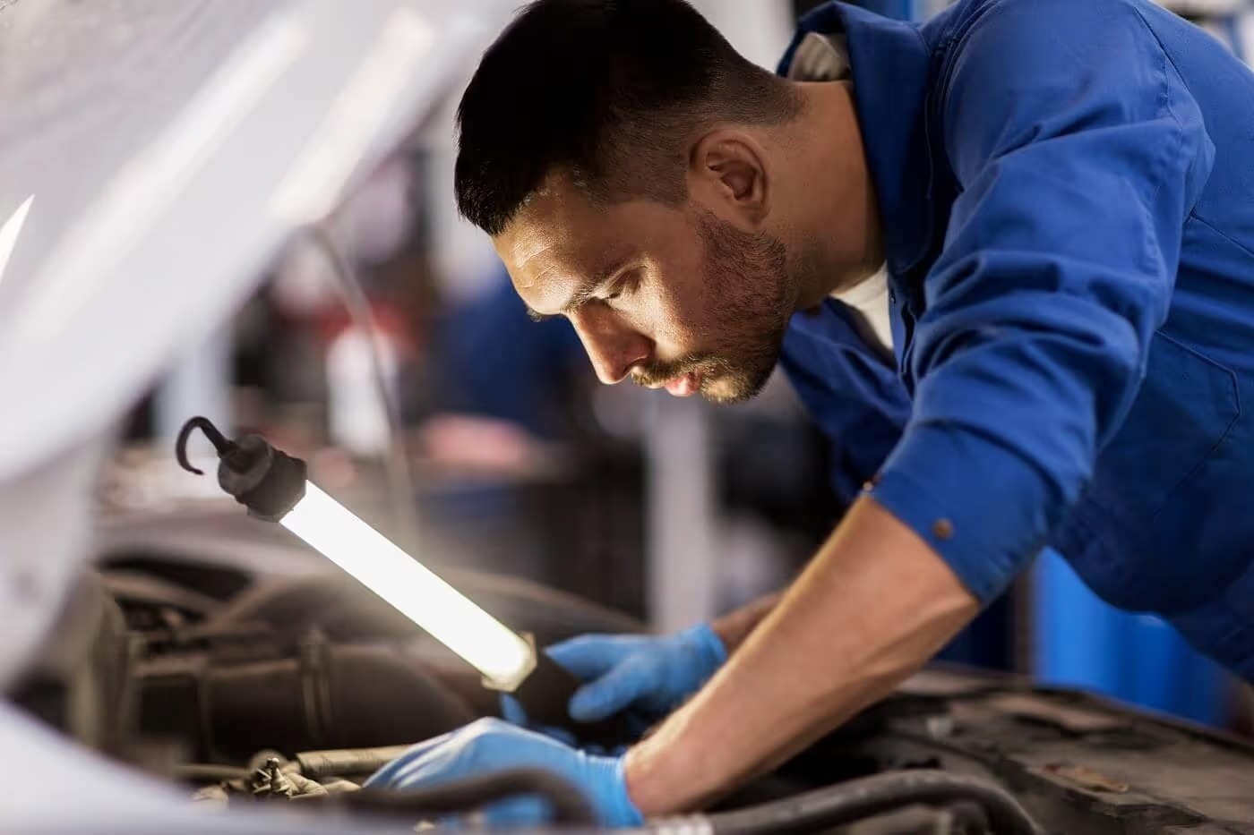Technician inspecting a certified used vehicle