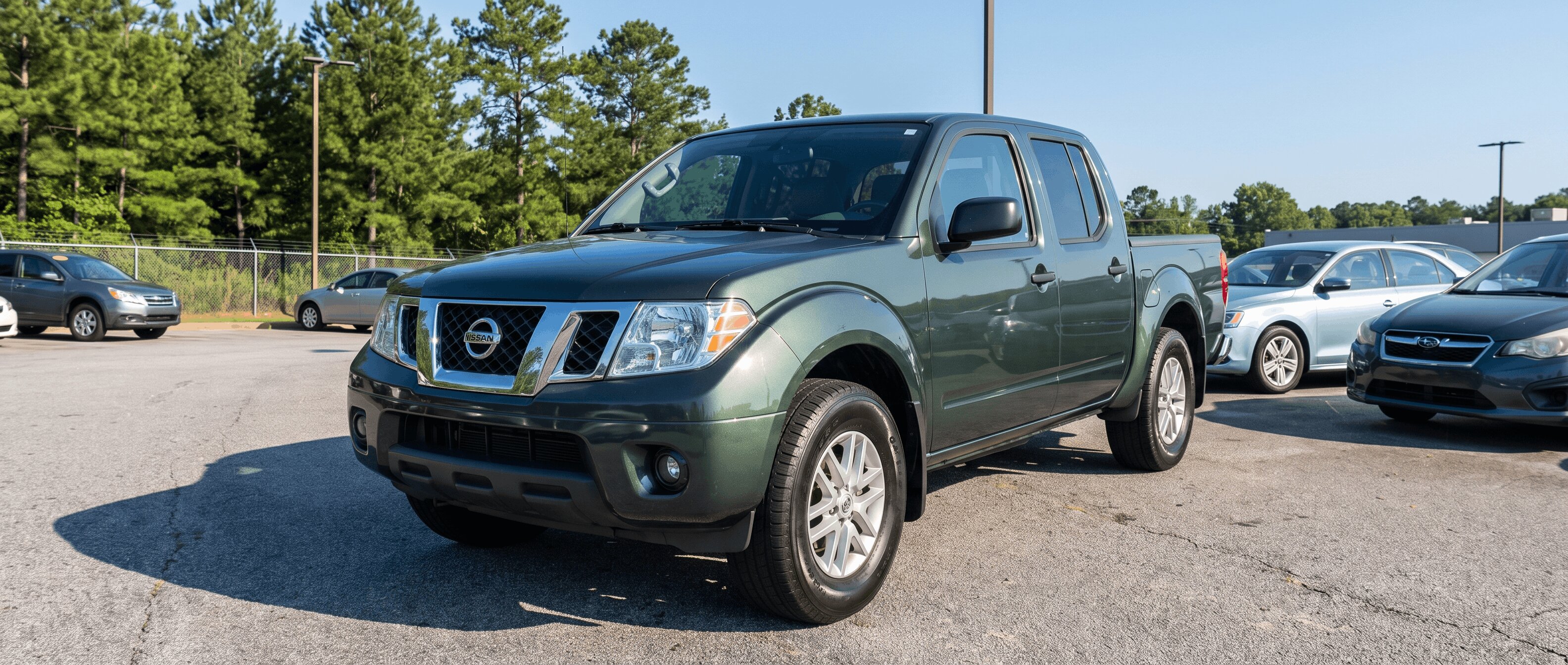 Used Nissan Frontier Crew Cab on a metro Atlanta dealership lot ready for pre-purchase inspection