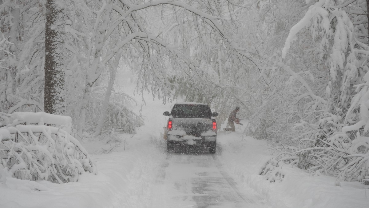 Pickup Truck Plowing Snow in Heavy Blizzard